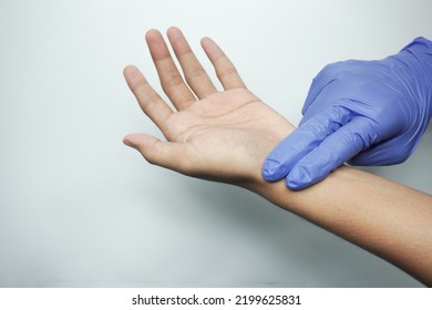 A Doctor Is Checking Radial Pulse Of The Patient That Has Palpitation. Vital Sign, Medical, Healthcare, Hospital, Physical Examination, Check Up Concept