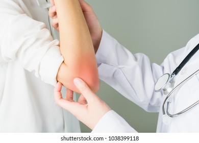 Doctor Is Checking The Symptoms. Red Rash On The Elbow Of The Woman.