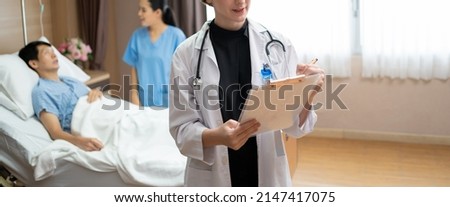 Similar – Doctor giving a prescription to senior patient