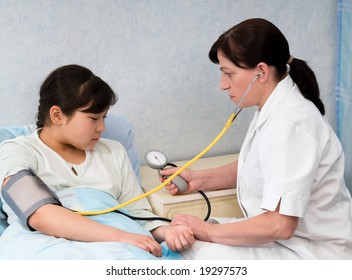 The Doctor Checks A Blood Pressure At The Child