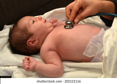 Doctor Checks Newborn Baby Heart Beat. Real People. Copy Space