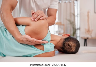 Doctor, chiropractor and woman with back pain for physiotherapy from a physiotherapist helping with spine alignment. Rehabilitation and chiropractic worker healing a healthy girls spinal posture - Powered by Shutterstock