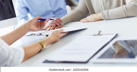 Doctor in clinic asking senior woman in wheelchair for a signature - Shutterstock ID 1632142504