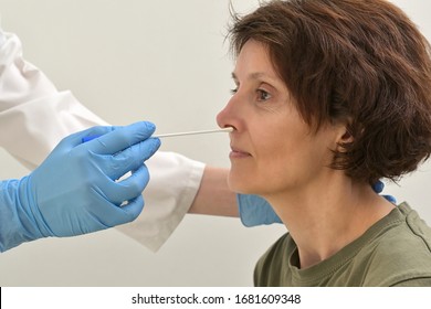 Doctor Collecting A Nasopharyngeal Nose And Throat Swab