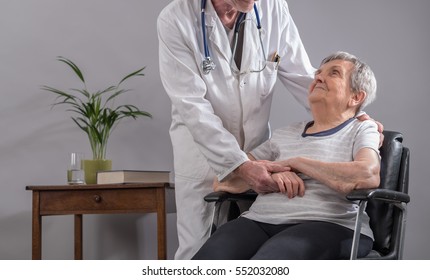 Doctor Comforting An Old Patient