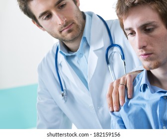 Doctor Comforting A Young Patient After Telling Him Bad News.