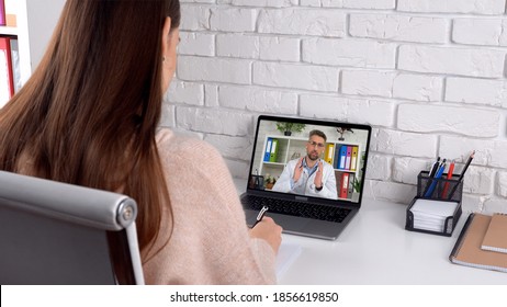 Doctor In Computer Screen Talk Teaches By Remote Webcam, Distance Medical Education. Woman Student Intern Study At Home Office Online Video Conference Call Laptop, Writes In Notebook Listen Teacher