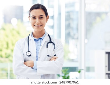 Doctor, confident and portrait in hospital for healthcare, medical advice and wellness with stethoscope. Woman, surgeon and crossed arms in clinic for job, experience and health with happiness - Powered by Shutterstock