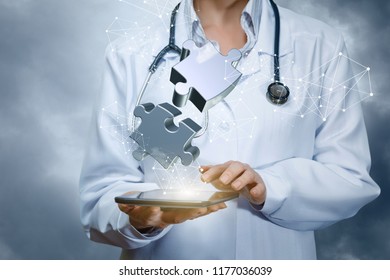 Doctor Connects The Virtual Jigsaw Puzzles On Tablet.