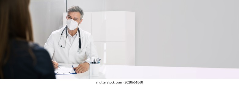 Doctor Consultant With Mask And Sneeze Guard Talking To Pregnant Woman