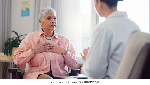 Doctor, consultation and elderly woman with chest pain for heart disease, advice and medical checkup. Healthcare, patient and worker with discussion for cardiac arrhythmia, palpitations and diagnosis