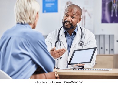 Doctor consultation, tablet mockup and patient consulting black man about medical results, healthcare report or hospital insurance. Mock up product placement, digital tech and advice for senior woman - Powered by Shutterstock