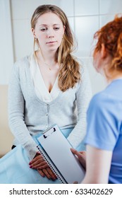 Doctor Consulting Her Female Patient. Patient And Doctor Sitting In Office. Diagnostic, Prevention Of Women Diseases, Healthcare, Medical Service, Consultation Or Education, Healthy Lifestyle Concept