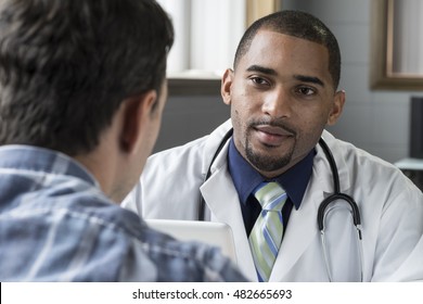 Doctor Consulting With Male Patient 