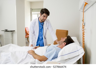 doctor consulting patient lying on hospital bed talking happy about the diagnose and treatment in modern clinic background in health care and medical insurance concept