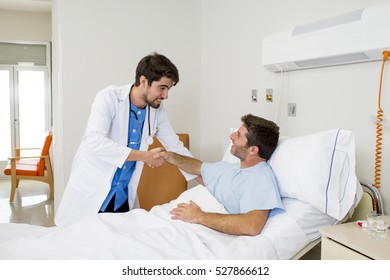 Doctor Consulting Patient Lying On Hospital Bed Being Released Shaking Hands  In Modern Clinic Background In Health Care And Medical Insurance Concept