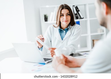Doctor consulting patient. Patient sitting at doctor office. Diagnostic, prevention of diseases, healthcare, medical service, consultation or education.
