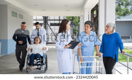 Doctor consulting senior man at hospital. Medical staff explaining diagnosis to patient. Medicine and healthcare concept.