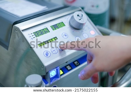 Doctor is controlling extracorporeal membrane oxygenation (ecmo) 