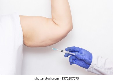 Doctor Cosmetologist Makes Mesotherapy And Ozone Therapy Injection To An Fat Elderly Woman S Hand, White Background, Biorevitalization, Lipofilling