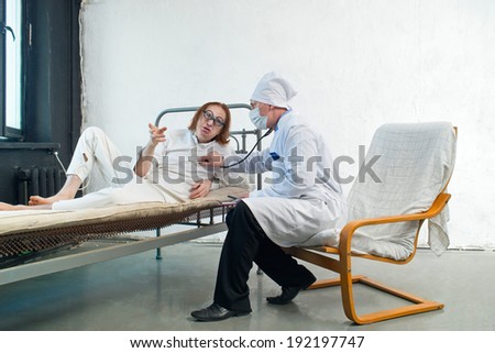 Similar – Caregiver helping elderly patient to stand up