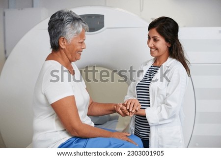 Doctor, ct scan and woman holding hands of patient in hospital before scanning in machine. Mri, comfort and happy medical professional with senior female person before radiology test for healthcare.