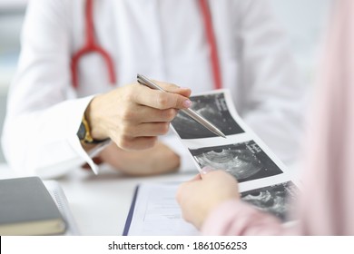 Doctor demonstrates results of ultrasound to patient. Medical ultrasound scan during pregnancy concept