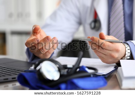 Doctor diagnoses based on tests and health data. At initial consultation, therapist asks about existing health problems and conducts medical examination. Doctor indicates preliminary diagnosis