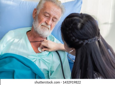 The doctor is diagnosing the patient on the bed of hospital. - Shutterstock ID 1432919822