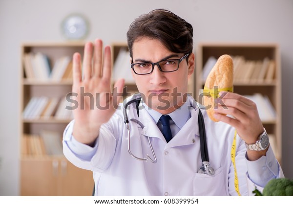 Doctor in\
dieting concept with fruits and\
vegetables