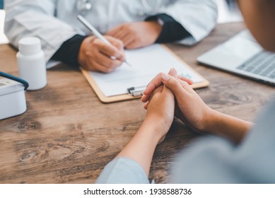 The doctor is discussing with the patient after a physical examination of the results and treatment  - Shutterstock ID 1938588736