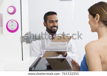 Doctor Discussing With Patient Before Mammogram X-ray Test