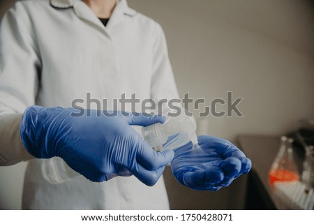 Doctor disinfect latex gloves with spray. medicine and health concept. in the hospital ward.