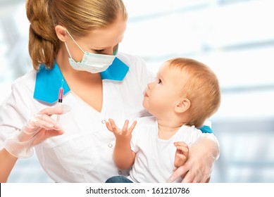 A doctor does injection child vaccination baby