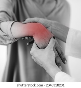 Doctor Doing Medical Exam With Senior Woman, Checking For Carpal Tunnel Syndrome.