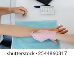 Doctor doing skin allergy test at white table in office. Allergy test - skin prick allergy testing for possible allergens.