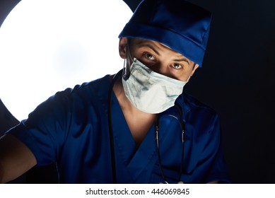 doctor doing surgeory in hospital look in camera