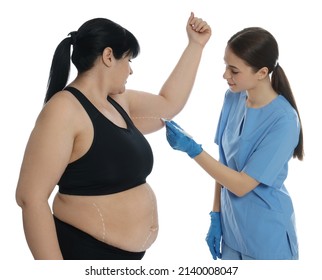 Doctor Drawing Marks On Obese Woman's Body Against White Background. Weight Loss Surgery