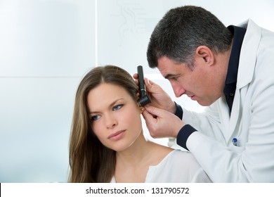 Doctor ENT Checking Ear With Otoscope To Woman Patient At Hospital