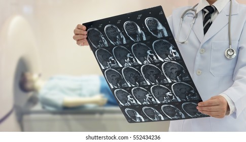 Doctor Examine Film X-ray The Brain By Mri Scan Of The Patient.