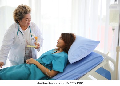 The doctor examined the symptoms of the patient on bed in the hospital