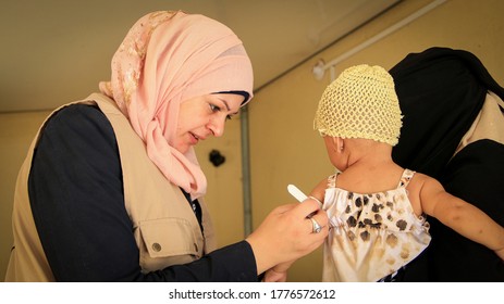 A Doctor Examines Child Malnutrition