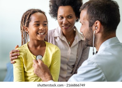 Doctor examines a child with stethoscope in examination room. Healthcare people children concept - Powered by Shutterstock
