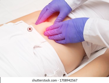 The Doctor Examines The Intestines Of The Patient With Abdominal Palpation. The Concept Of Bloating Of The Intestines, Flatulence And Intestinal Obstruction, Close-up