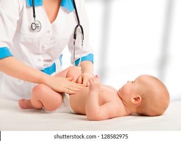 A Doctor Examines And Massaging Baby Tummy