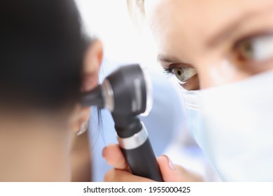 Doctor Examines Tympanic Membrane With Otoscope Closeup