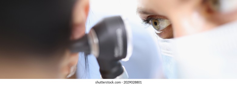 Doctor Examines Tympanic Membrane With Otoscope Closeup