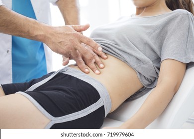 Doctor  Is Examining The Abdomen Of Patient