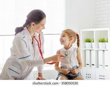 doctor examining a child girl in a hospital