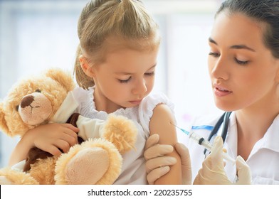 doctor examining a child in a hospital